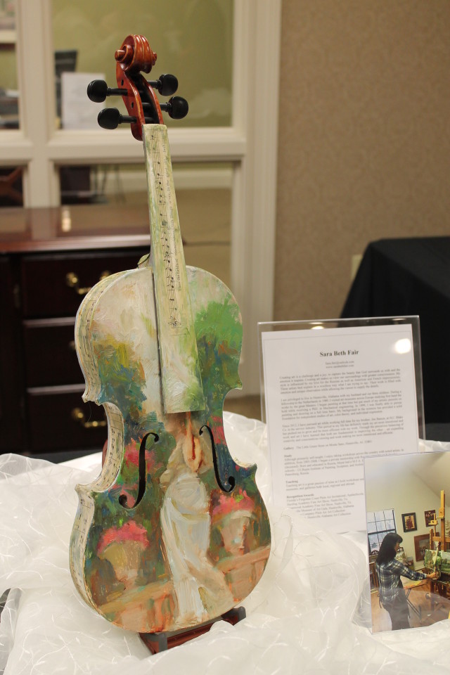 Violin painted by Huntsville artist Sara Beth Fair. (Inspired by her love of and trips to Paris.)